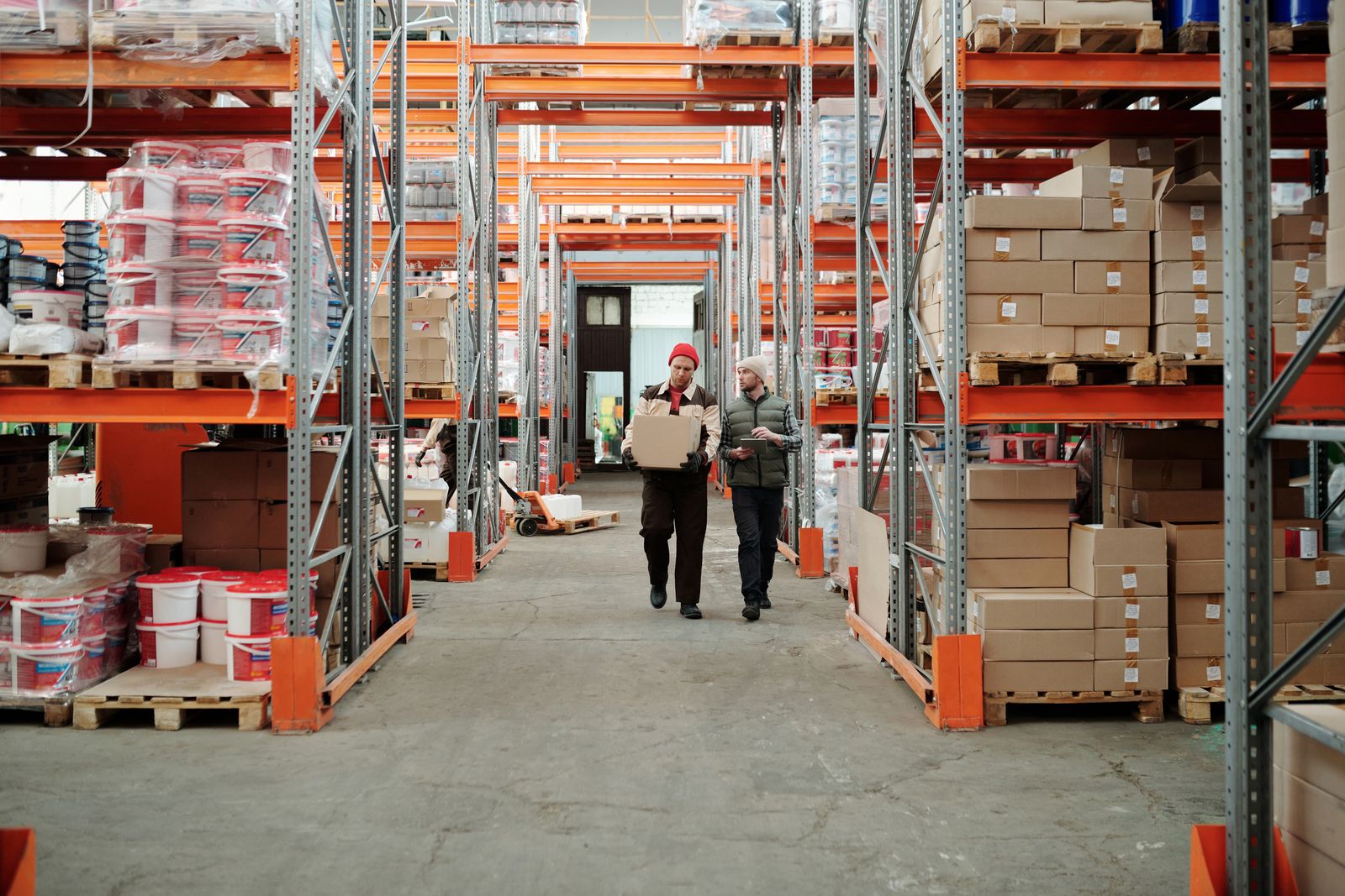 Warehouse worker scanning parcels on a fulfilment line