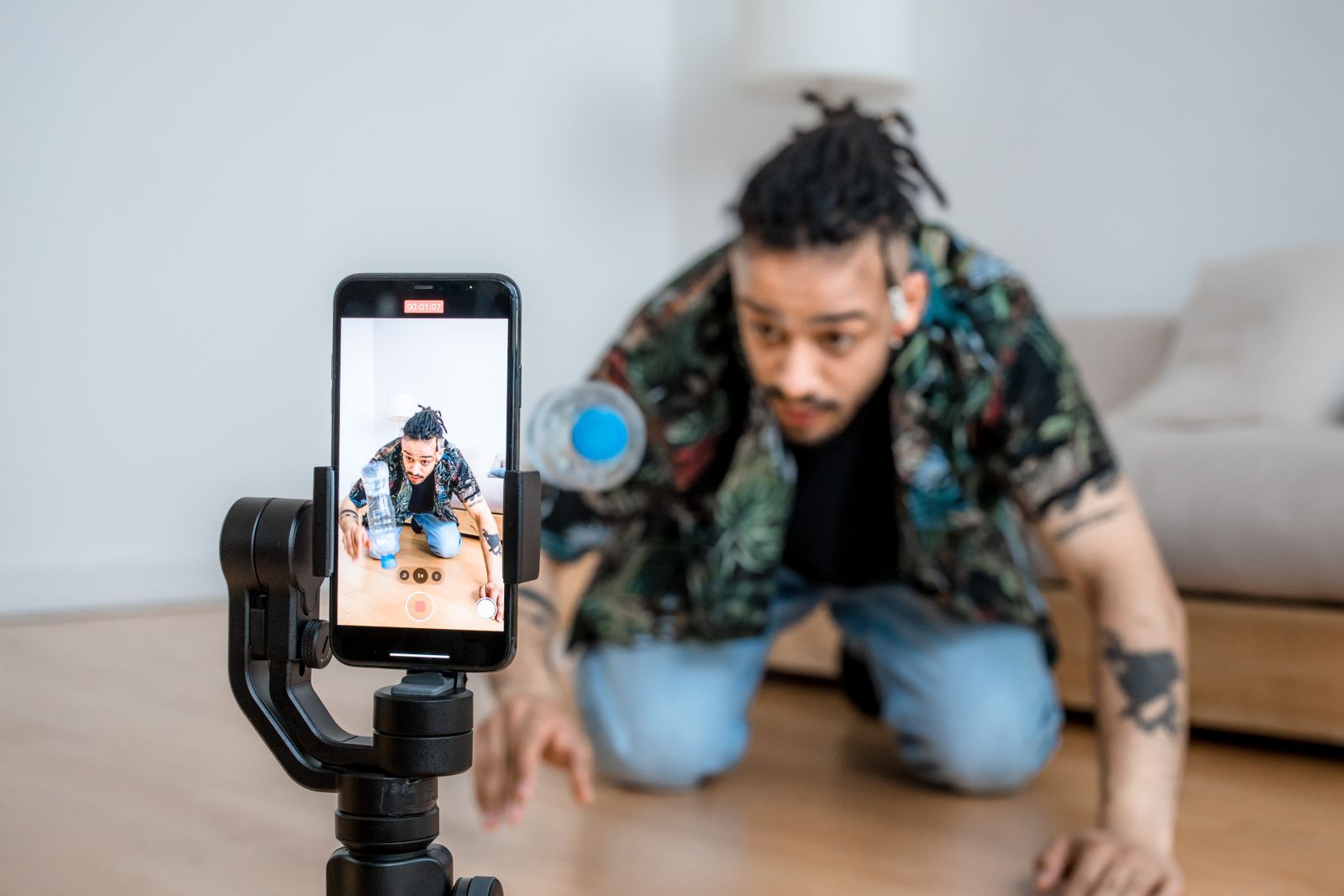 Creator filming a product review with a phone on a tripod
