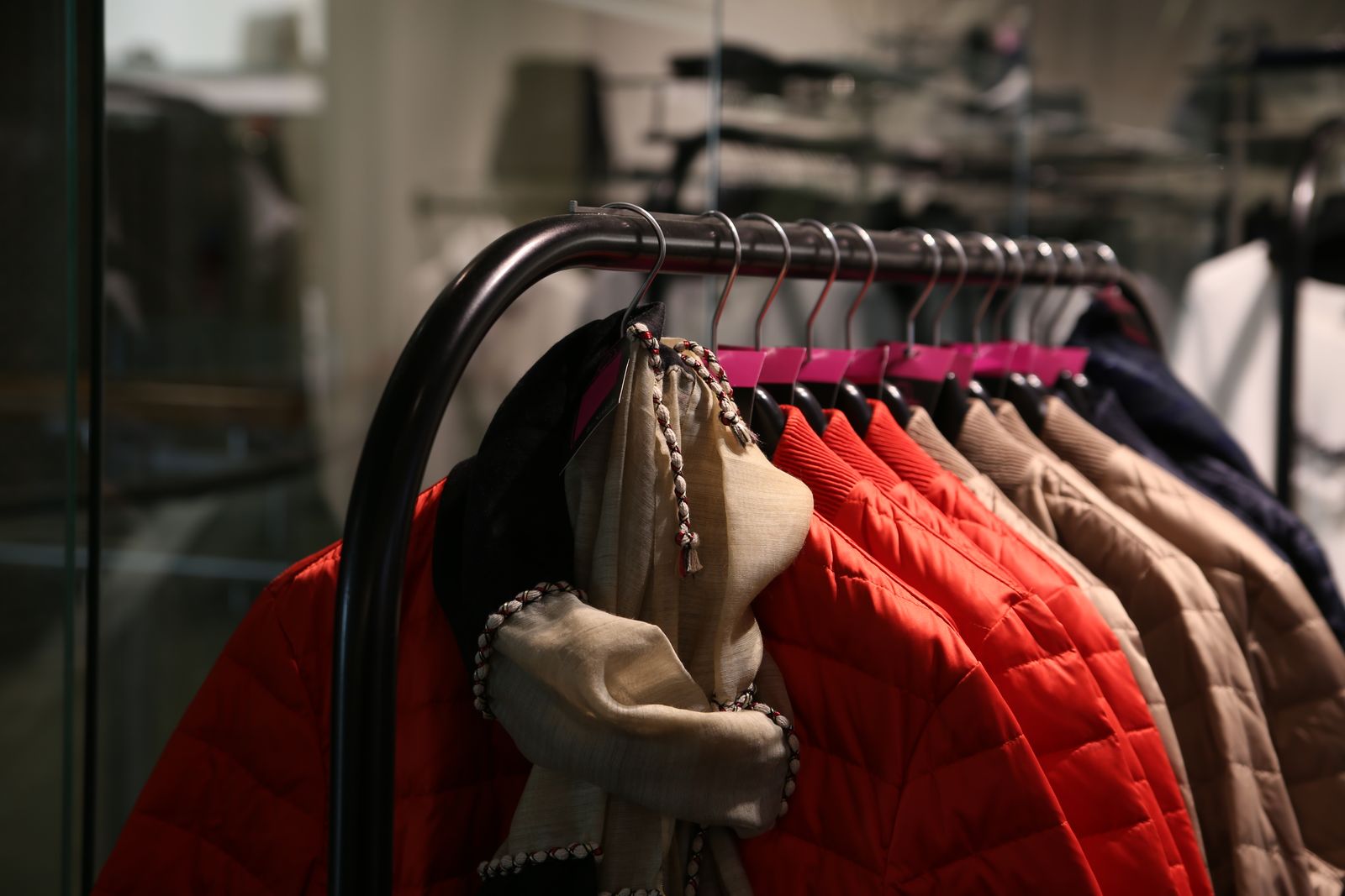 Rails of clothing in a fashion warehouse
